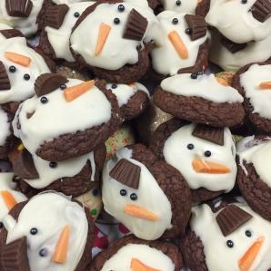 A photo of a pile of home-made snowman cookies