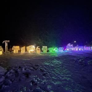 A night time look at all the ice scultures aglow with different colored lights