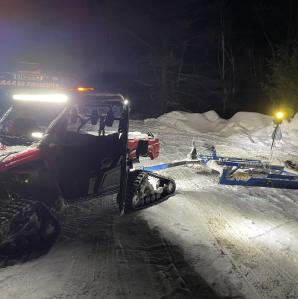 A mini groomer working at night