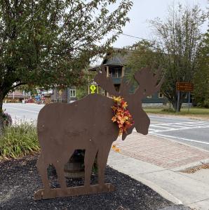 Moose cut out by road side.