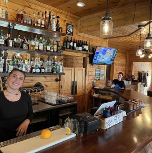 inside picture of the bar with two ladies working
