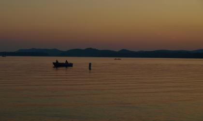 A lake during a hazy sunset.