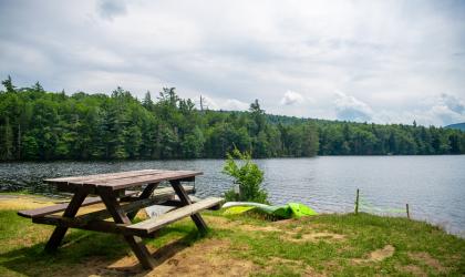 A picnic table by the water