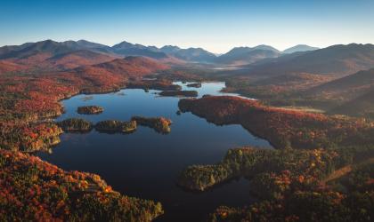 Aerial fall view of a complex of ponds among mountains