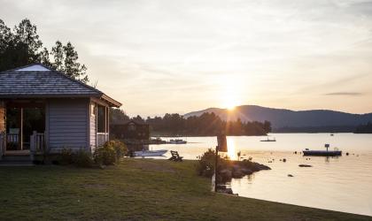 One of the finest places to watch the sunset is Blue Mountain Lake Beach.