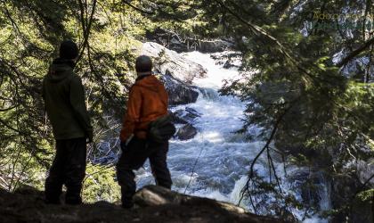 A couple looks out at Auger Flats Falls