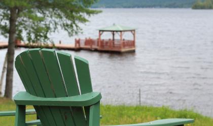 A gazebo floating on a dock in the water.