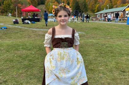 A girl dressed in German costume for Oaktoberfest