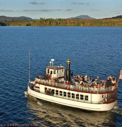 WW Durant Boat on the lake with mountains in background