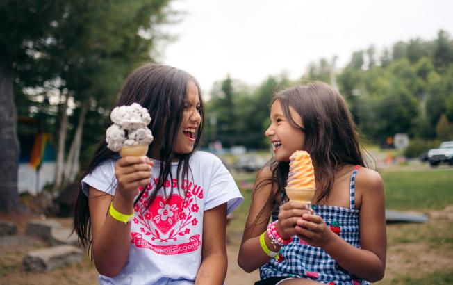 Two kids enjoying ice cream
