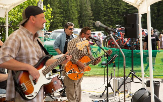 A band plays music at an outdoor venue.