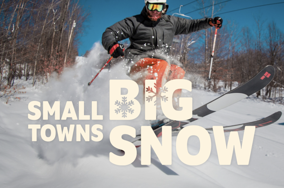 An image of a skier is overlain by the words "Small Towns, Big Snow"