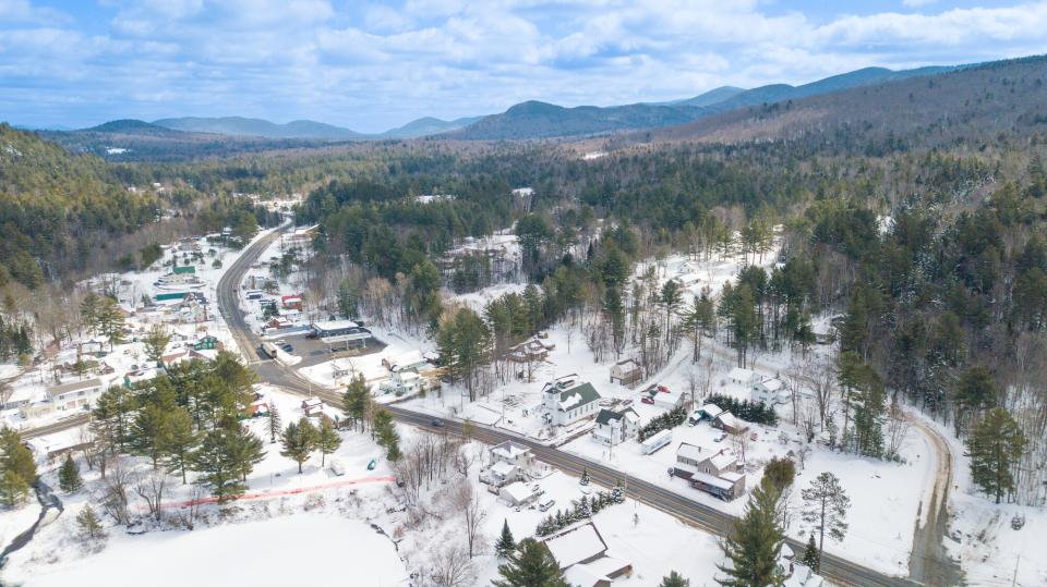 A winding road through a town in the winter