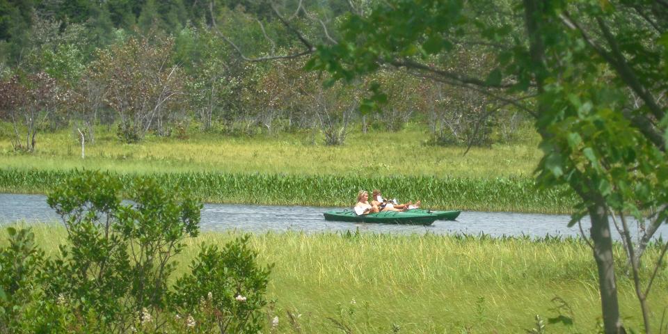 Paddling past the Sacandaga River Pathway Overlook in Speculator, New York