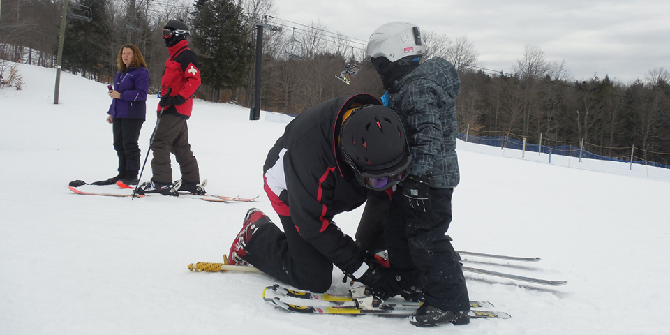 Put skis on properly