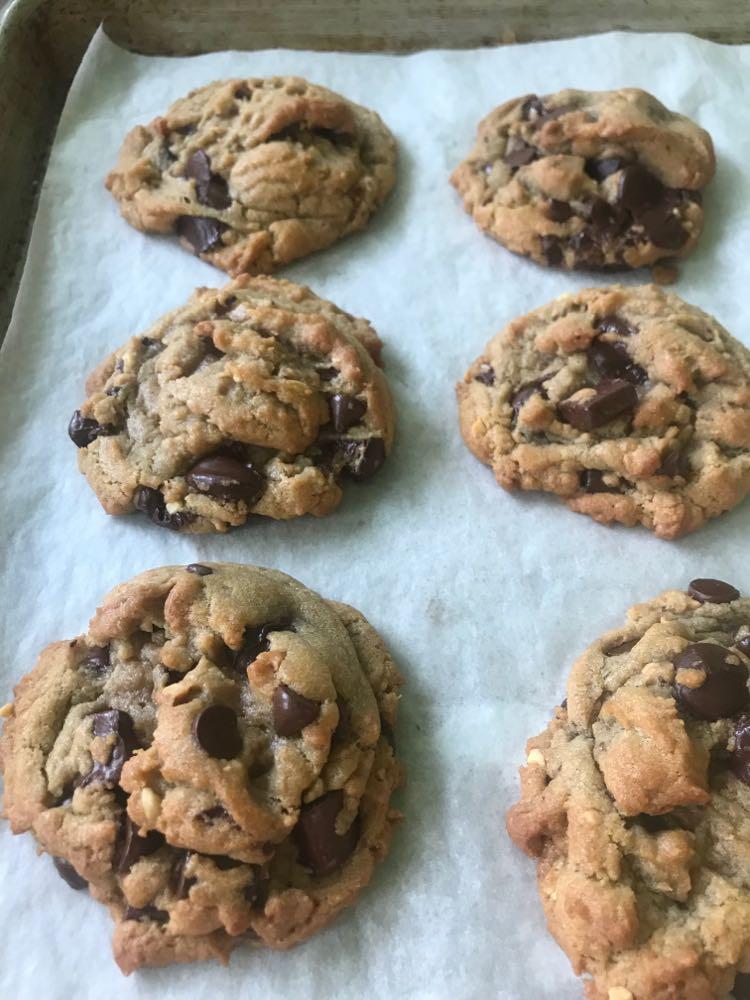 A tray of freshly baked triple chocolate peanut butter cookies