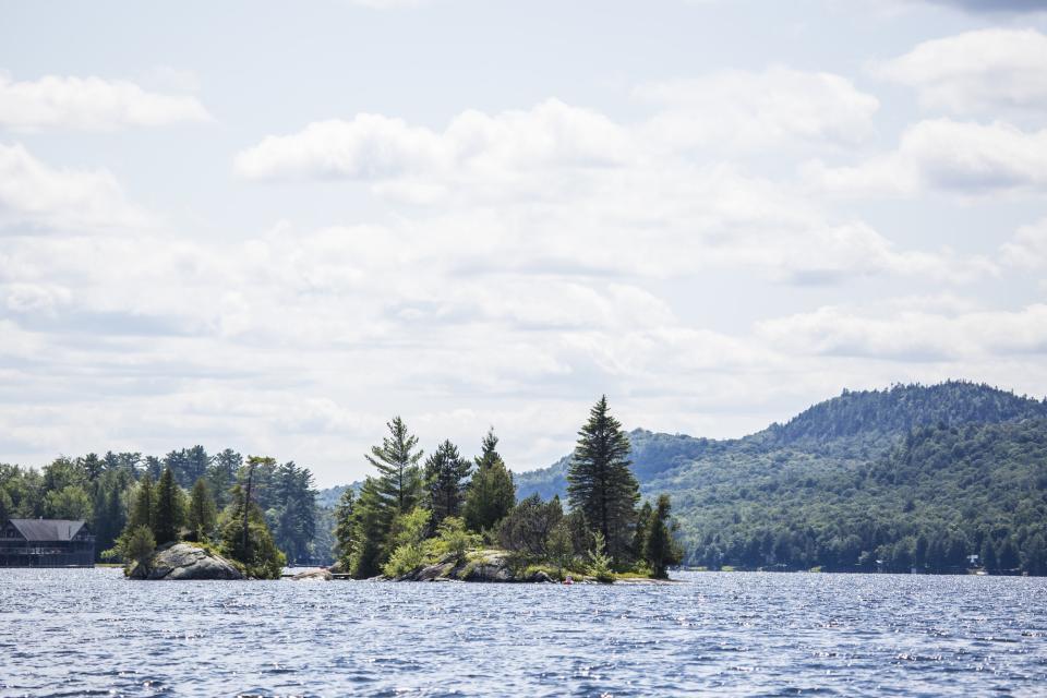 Mini island in a lake on a clear day.