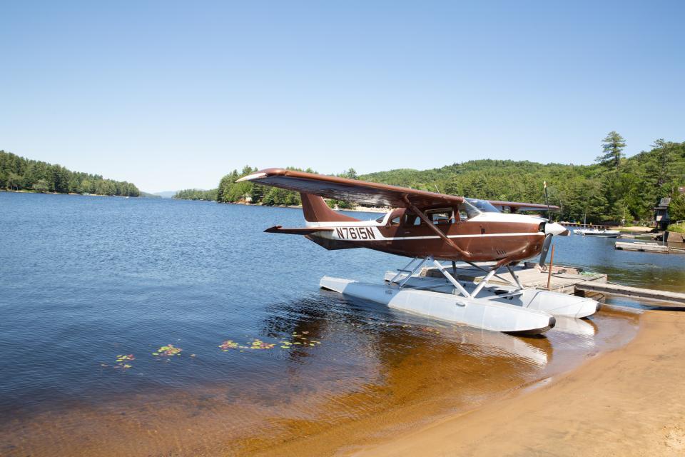 A float plane at a beach