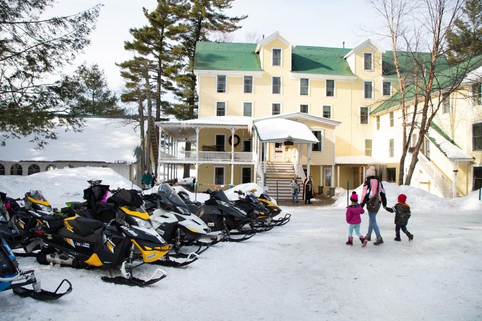 A view of the front of the Woods Inn in Inlet on a sunlit winter's day