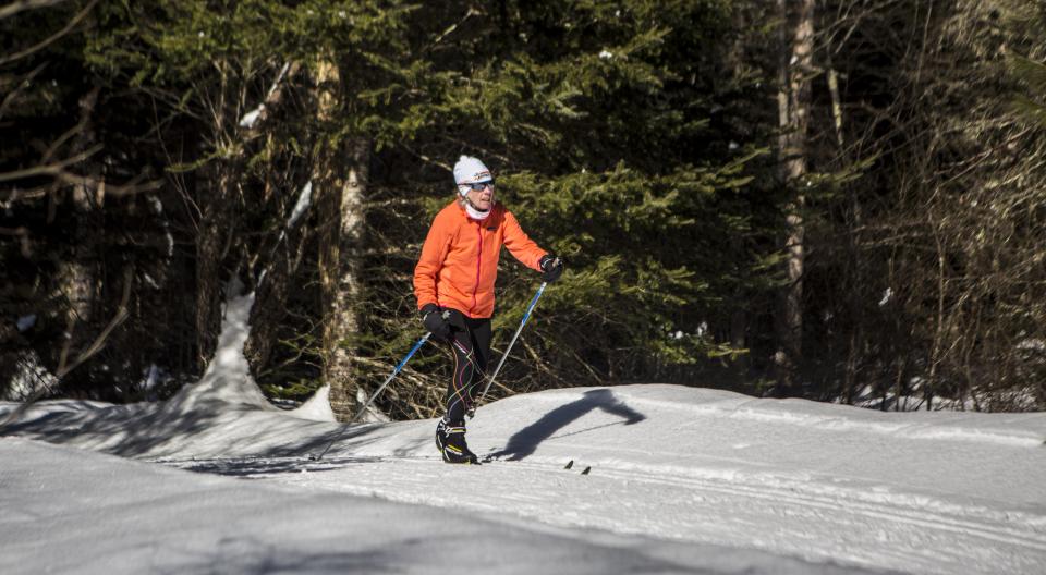 A cross country skier on a trail at Lapland Lake.