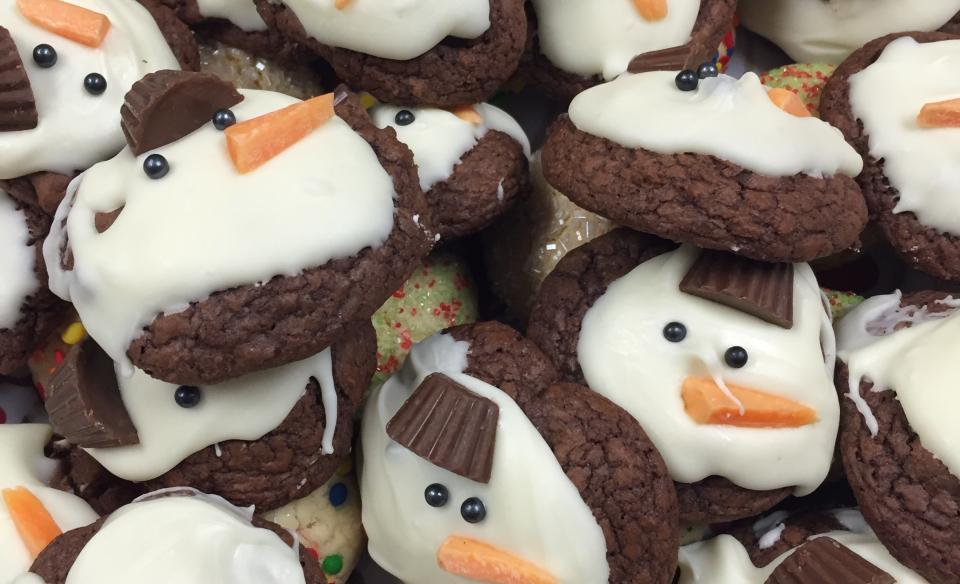 A photo of a pile of home-made snowman cookies