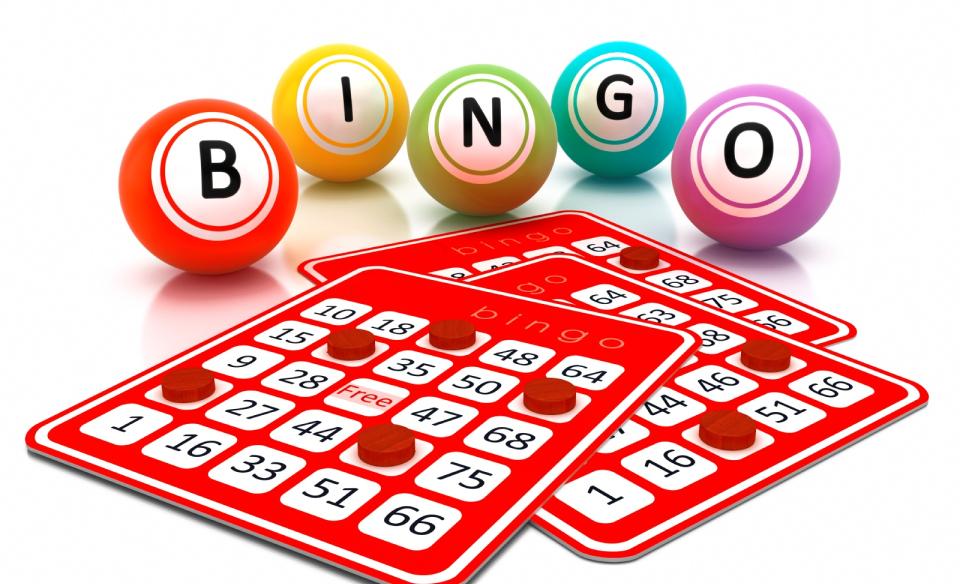 Three BINGO cards with red dots on some of the spaces with five large balls in the background spelling out BINGO