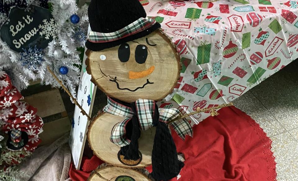 A snowman made from wood slices