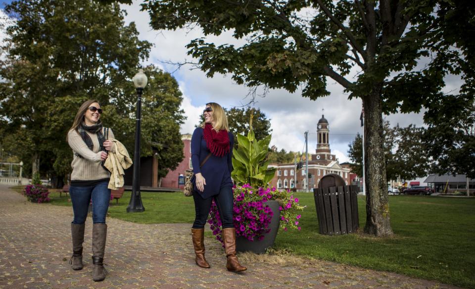 two women walking on a fall day