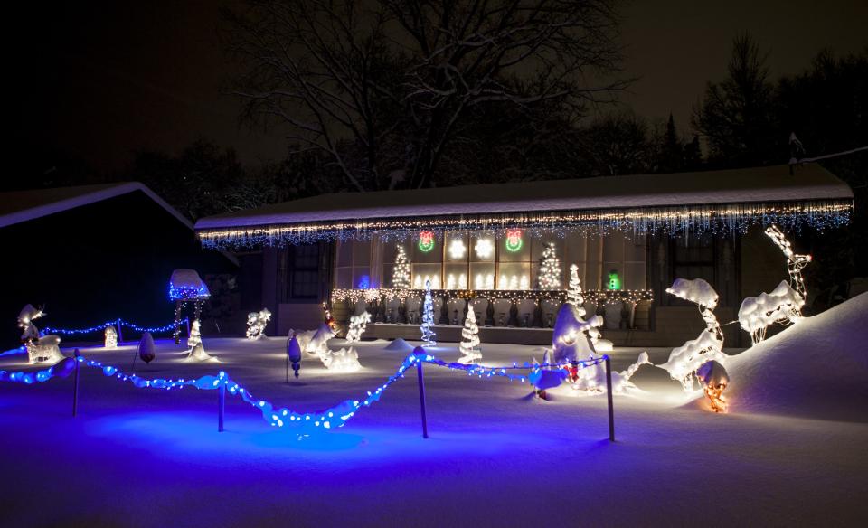 A home decorated with lights for Christmas