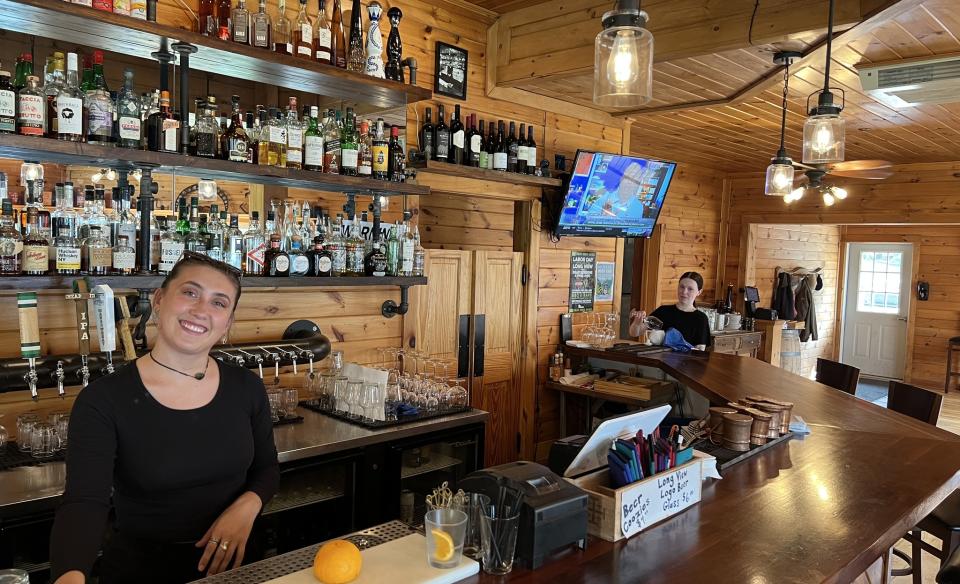 inside picture of the bar with two ladies working