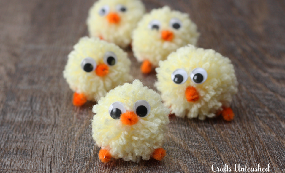 small chicks made out of pom poms and google eyes