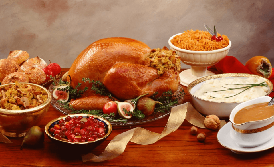 A table display of a traditional turkey dinner and sides