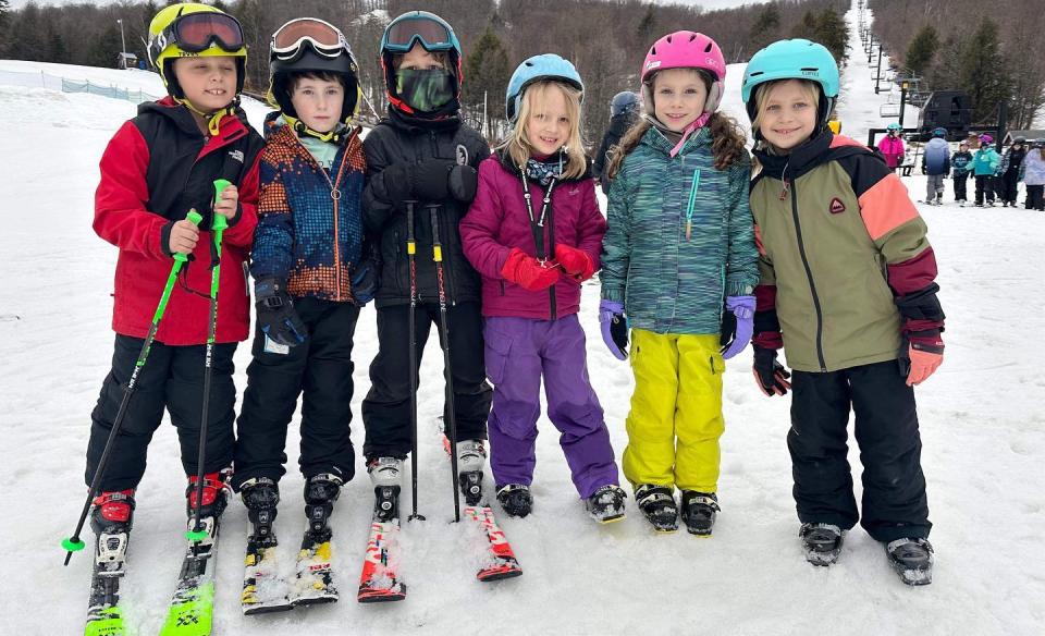 a-group-of-kid-skiiers-together-for-a-photo