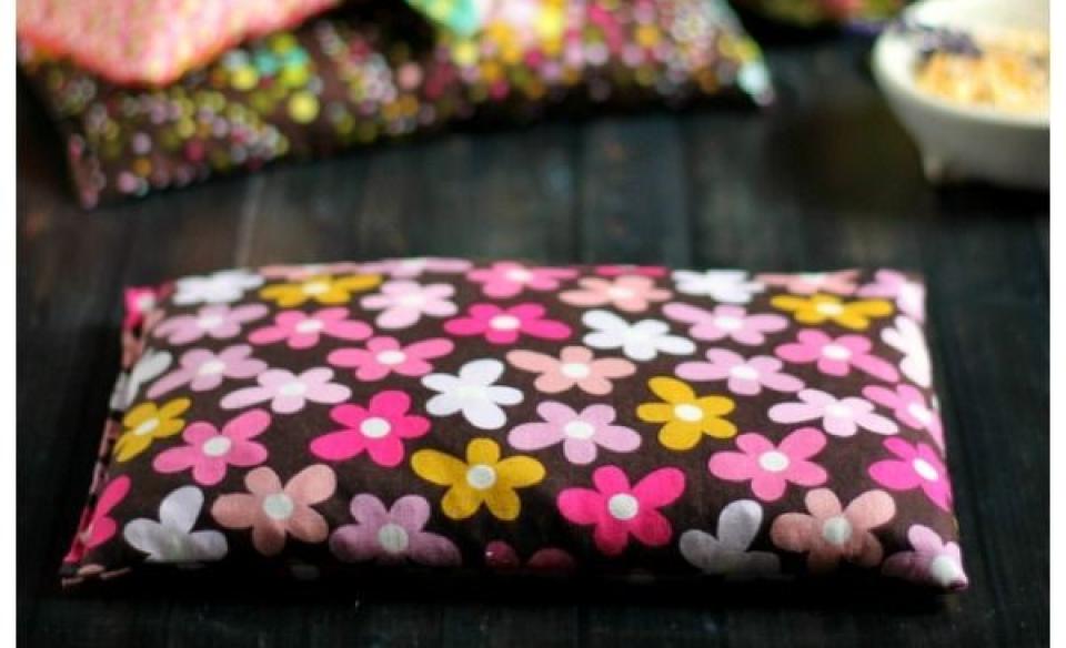 A photo of a hand made heating pad made of floral fabric