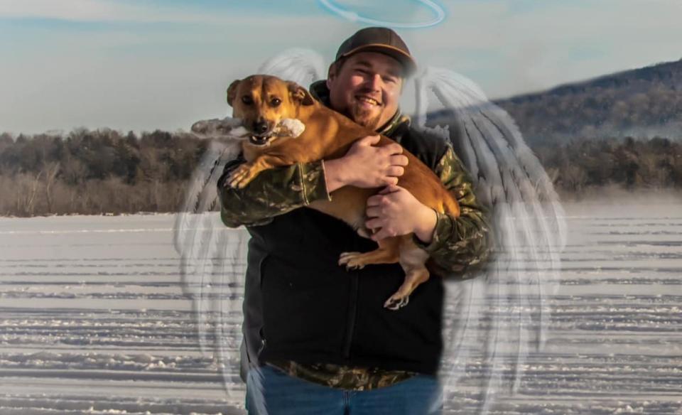 A photo of Joey holding a dog with images of angel wings and a halo over his head,