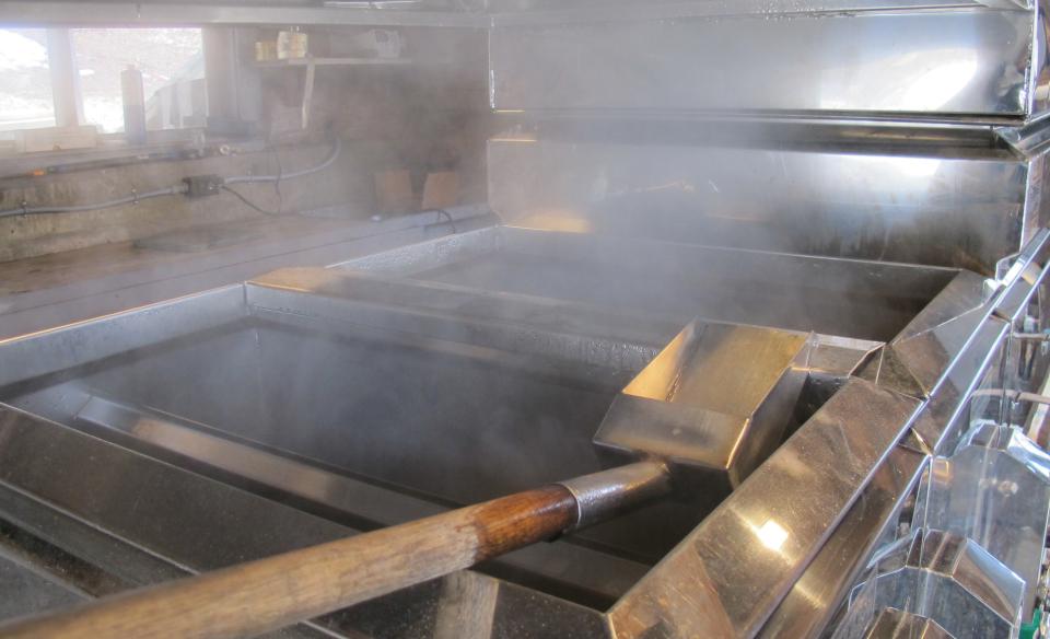 Maple syrup boilers steaming with hot sap