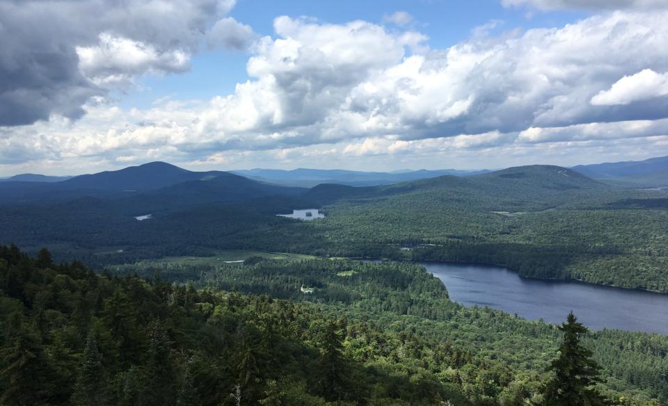 The view of mountains and a large lake from above