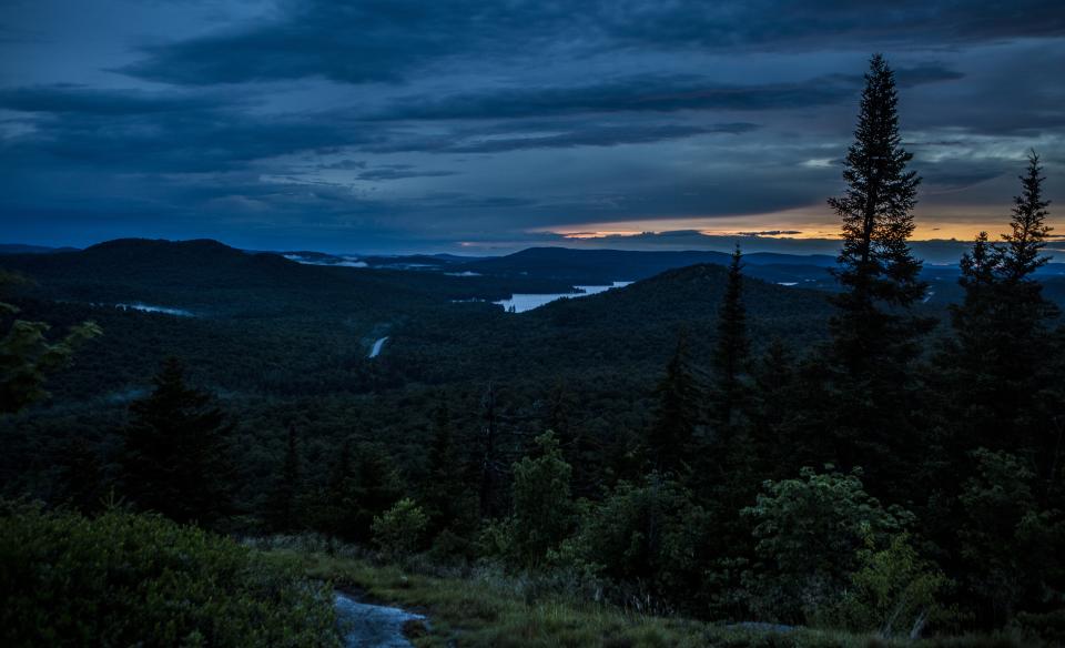 Hike up with headlamps to watch the sun rise from the peak