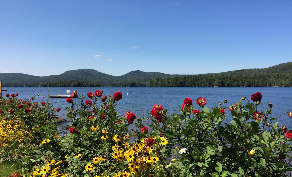 Enjoy the beauty of a lovely lake with a mountain backdrop.