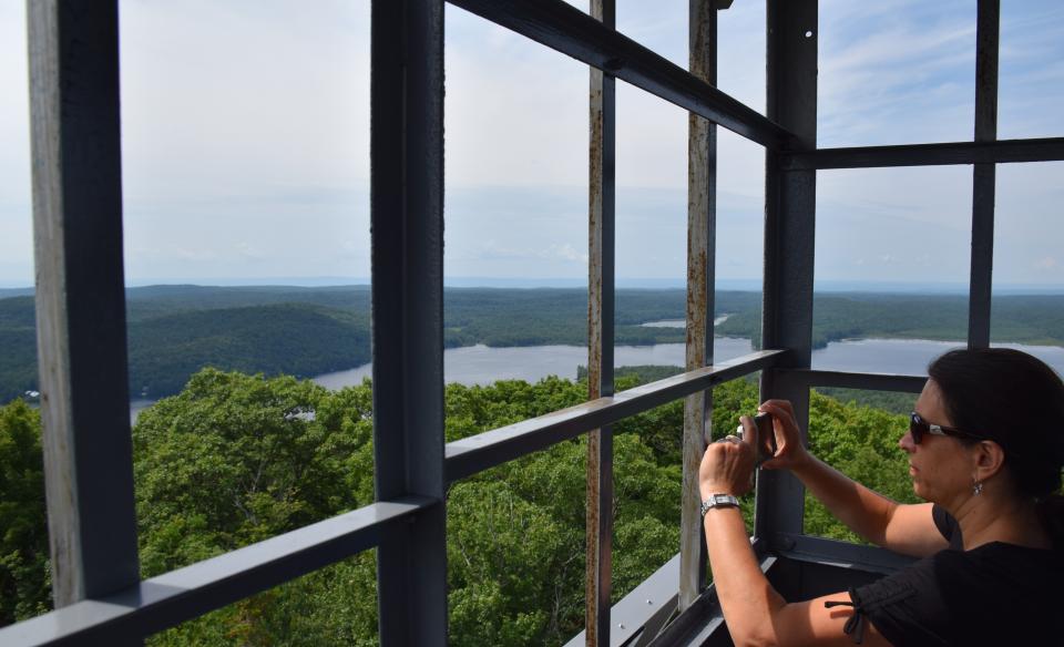 Someone taking a picture from inside an Adirondack fire tower