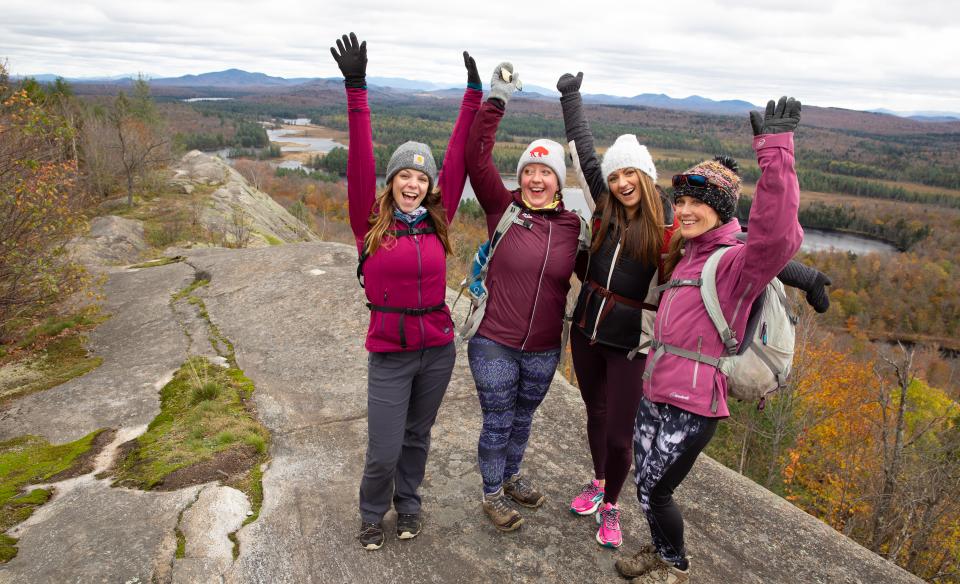 A joyous group celebrates their summit of Lows Overlook.