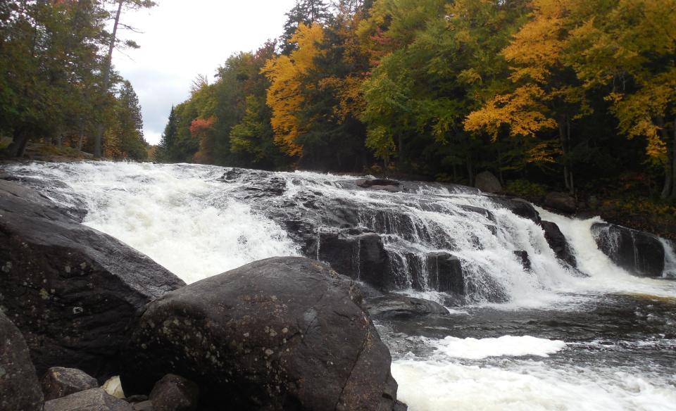 Fall foliage surrounding Buttermilk Falls