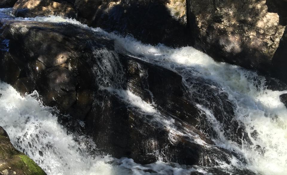 Closeup photograph of water cascading down Christine Falls.