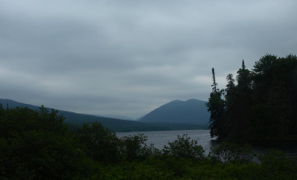 A small mountain pond on a cloudy day