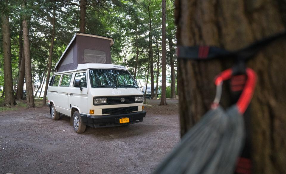 An adventure van photo taken from a hammock.