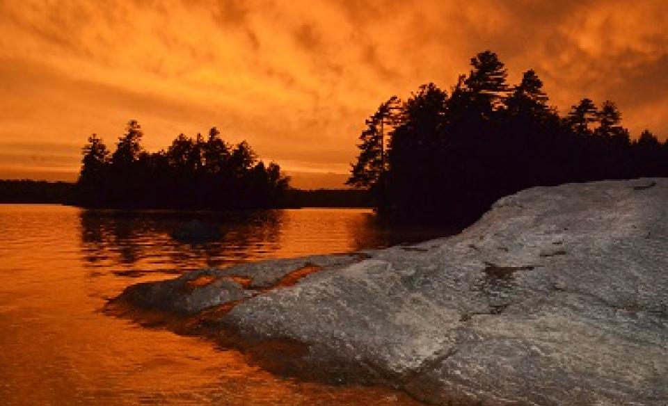 Sunset from a large rock by the water