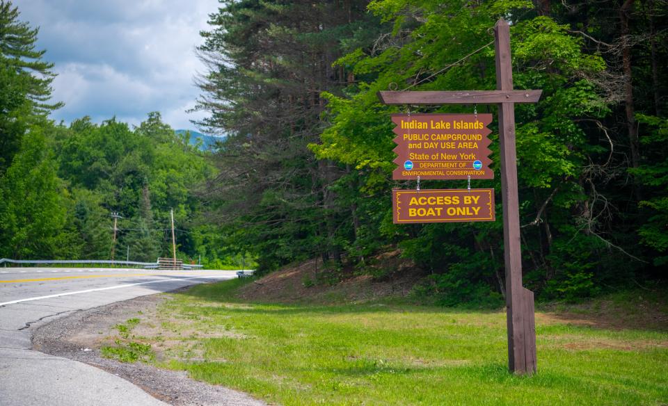 A large wooden sign for Indian Lake Islands Campground