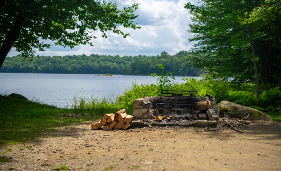 A fire pit by a lake