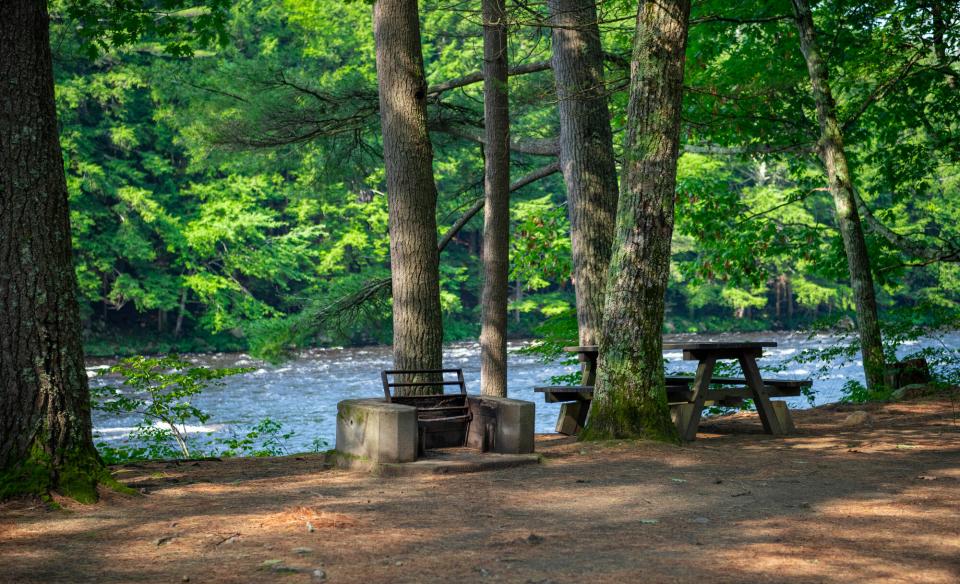 Picnic tables and firepits at the Sacandaga River Campground