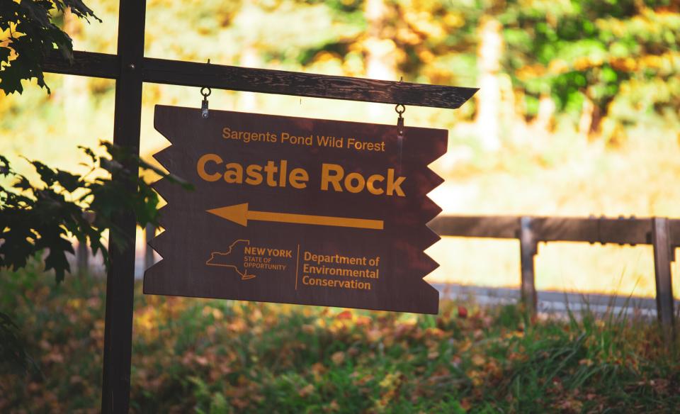 A wooden sign for Castle Rock